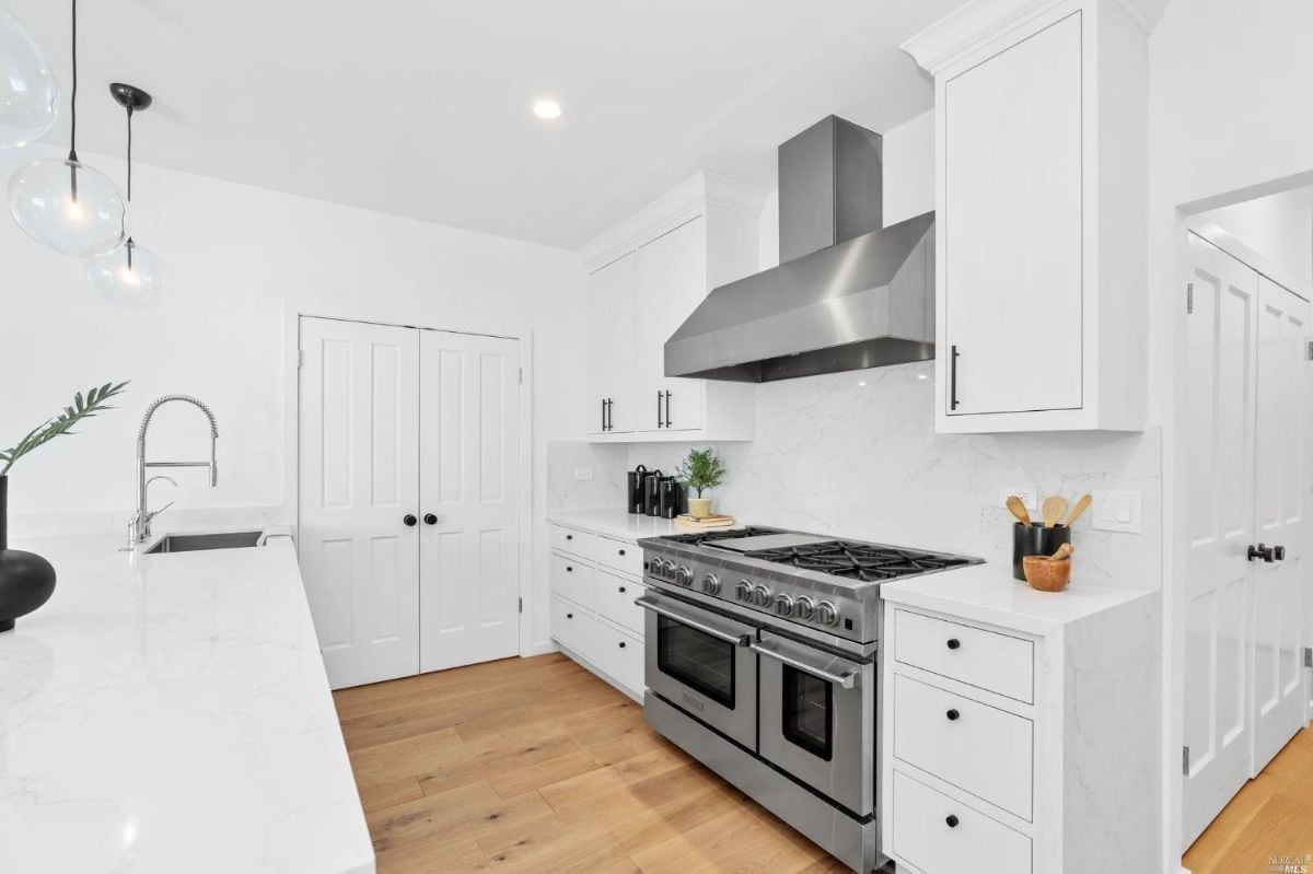 Kitchen with a stove, oven, and sink.