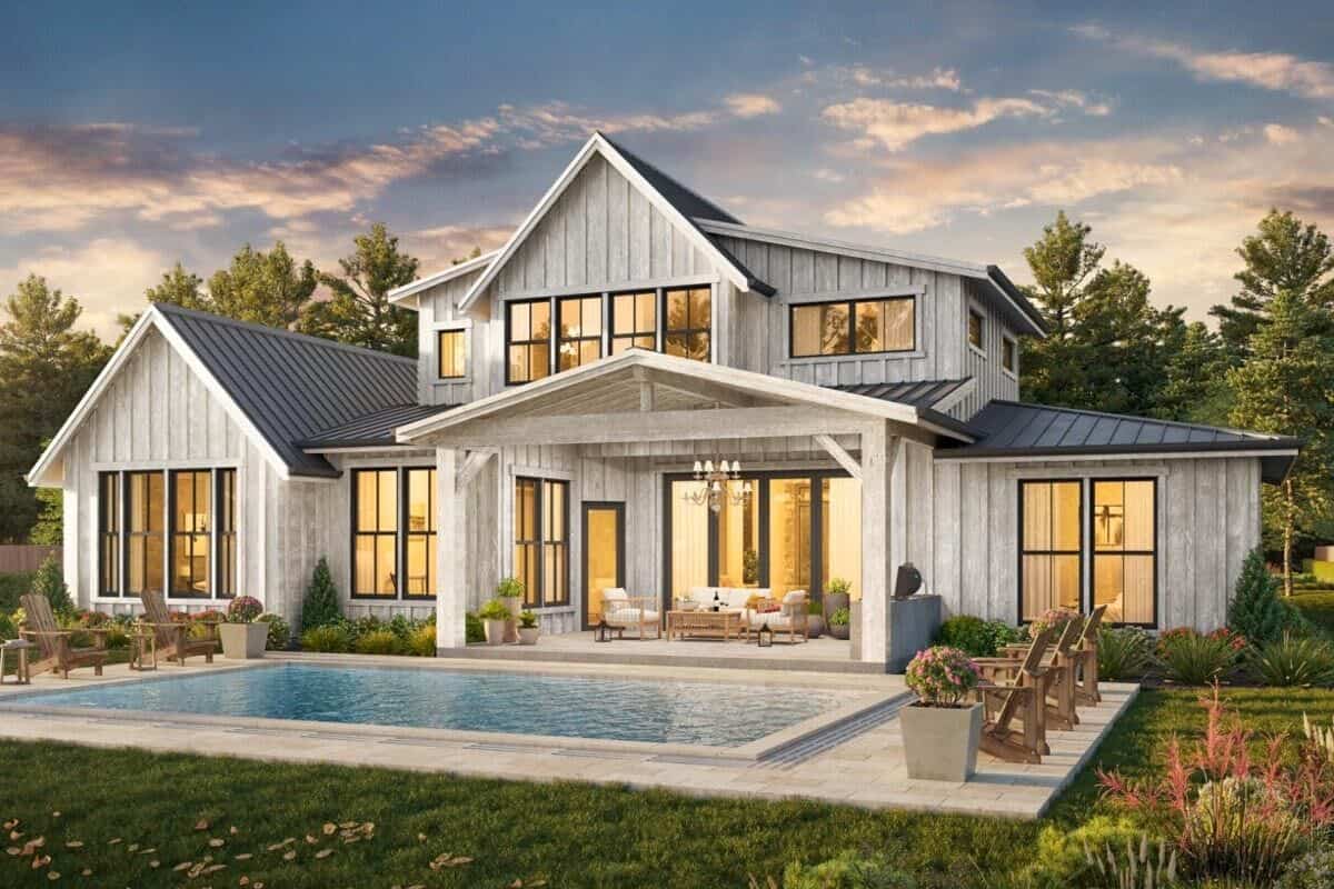 Rear rendering with rustic board and batten siding, aluminum-framed windows, and spacious outdoor living.
