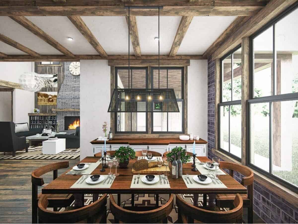 Dining room with a buffet table, a wooden dining set, and a linear chandelier hanging from the beamed ceiling.