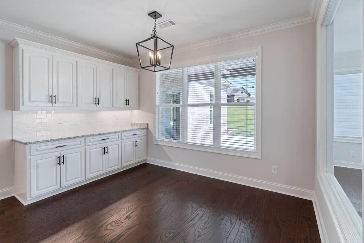 Breakfast room with a built-in hutch and a view of the backyard.