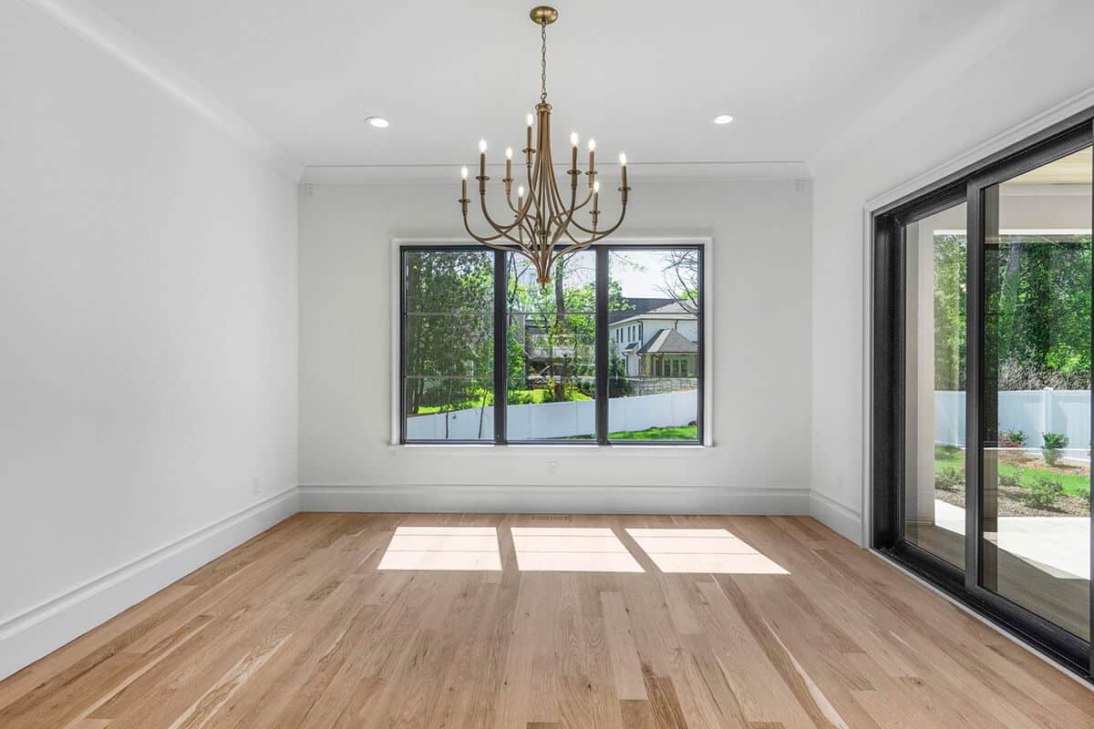 The keeping room has excellent rearward views and access to a covered terrace via glass sliders.