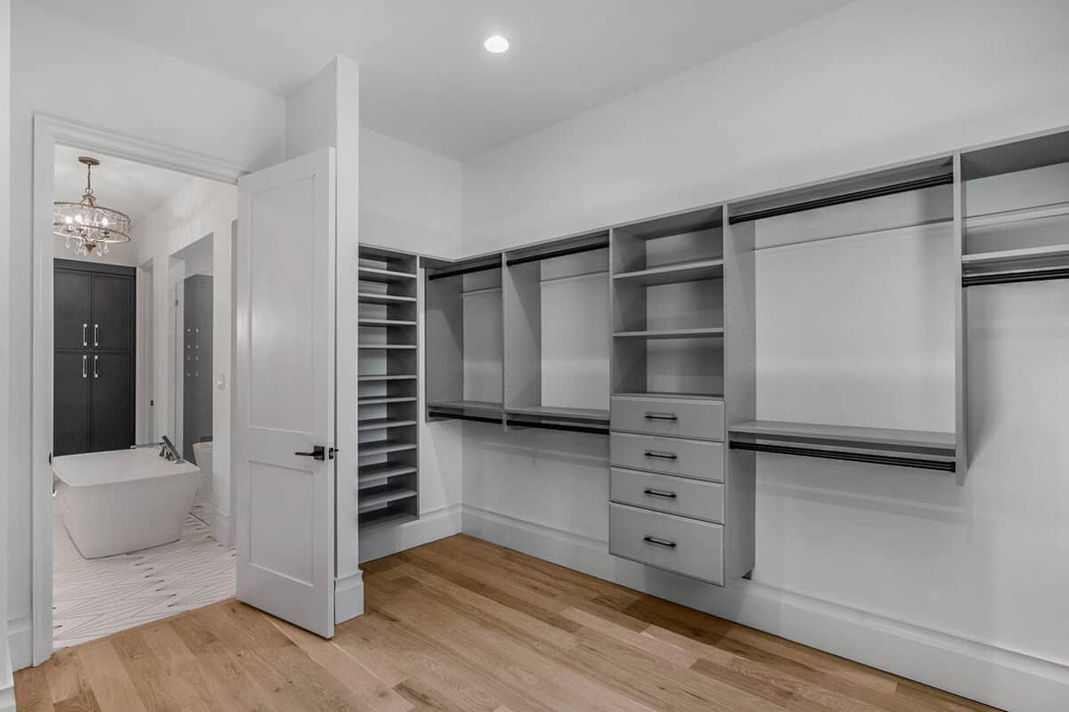 The primary walk-in closet offers ample storage space.