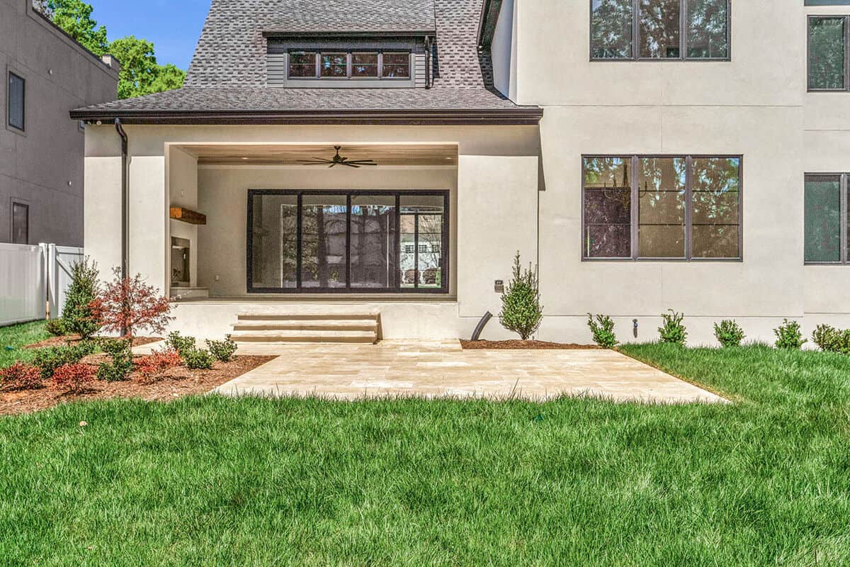 The covered terrace seamlessly transitions to an airy patio.