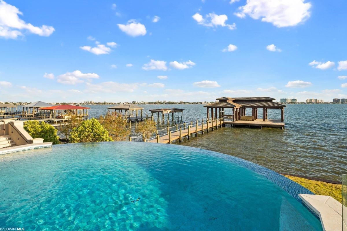Waterfall zero edge gunite pool.