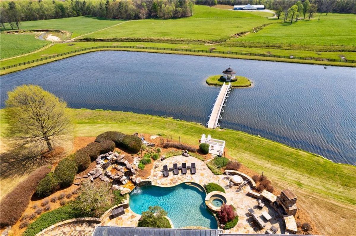 An outdoor pool and the flowing stream's aerial view.