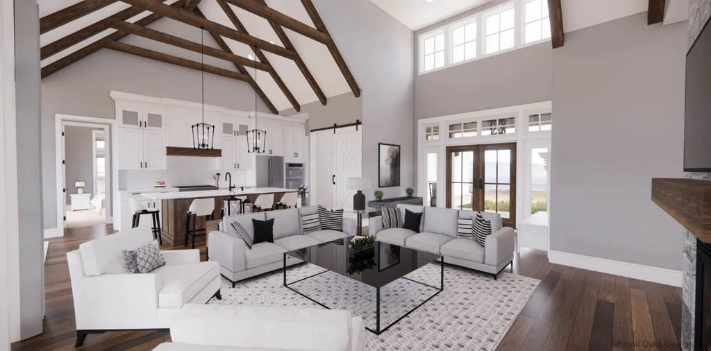 Great room and kitchen with a vaulted ceiling, clerestory windows, and hardwood flooring.
