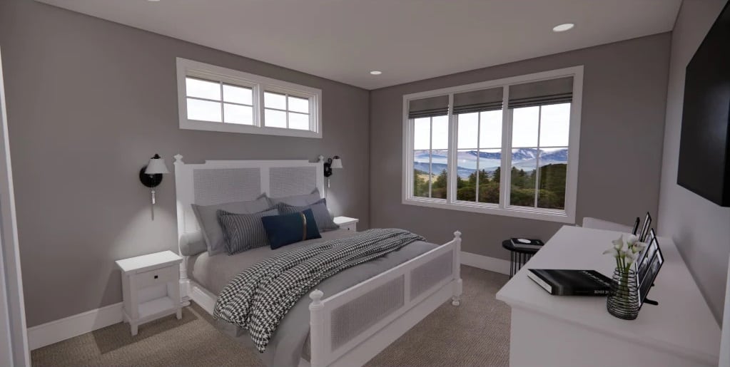Primary bedroom with white furnishings, a wall-mounted TV, and white-framed windows overlooking the surrounding landscape.
