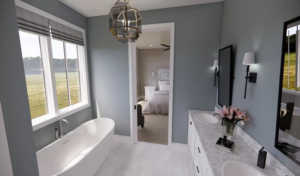 Primary bathroom with a dual sink vanity, a soaking tub, and expansive side yard views.