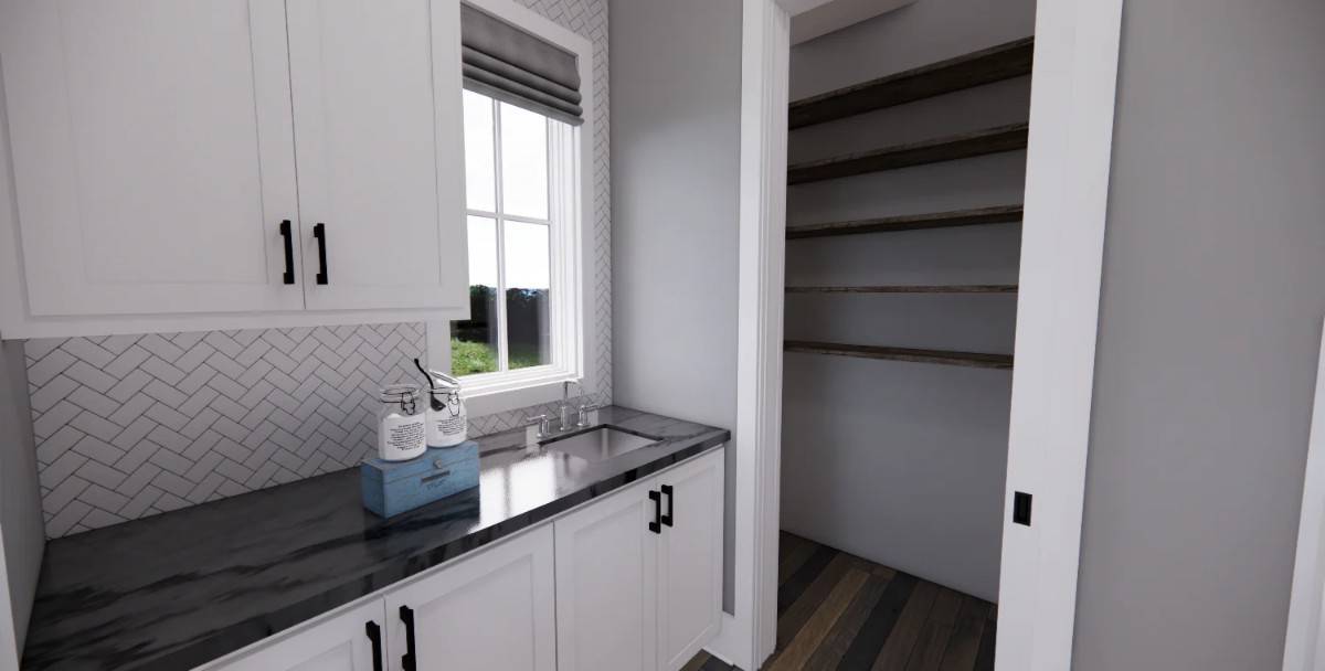 Prep kitchen with a marble countertop, a sink under the white-framed window,, and a walk-in pantry.