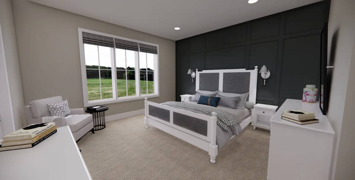 Primary bedroom with a black paneled accent wall and a small sitting area by the windows.
