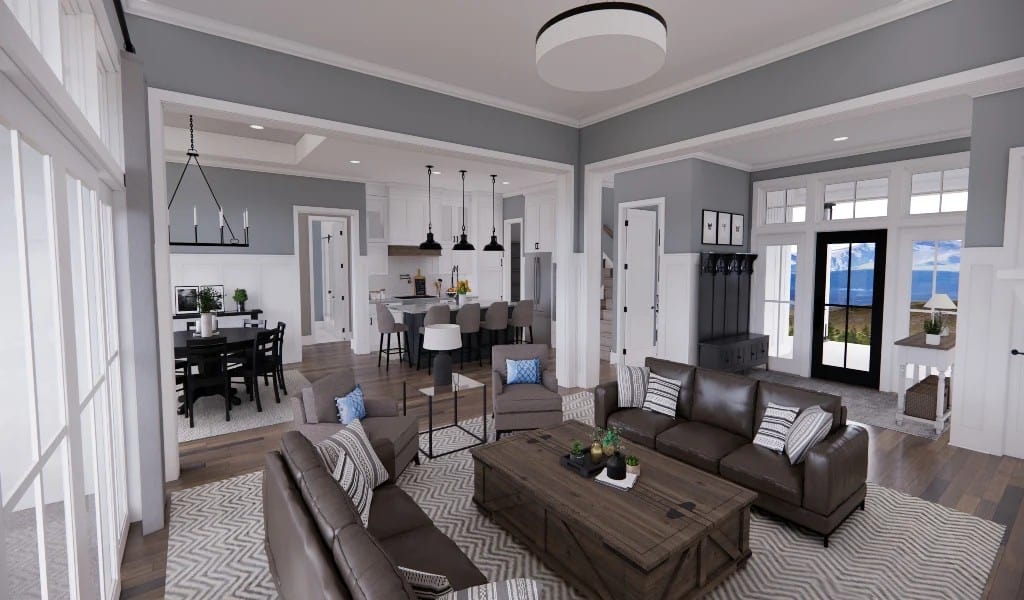 An open layout view of the foyer, great room, kitchen, and dining area connected by large openings.