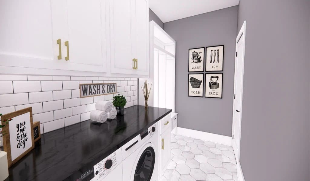 Laundry room with overhead cabinets, a marble countertop, and front-load appliances.