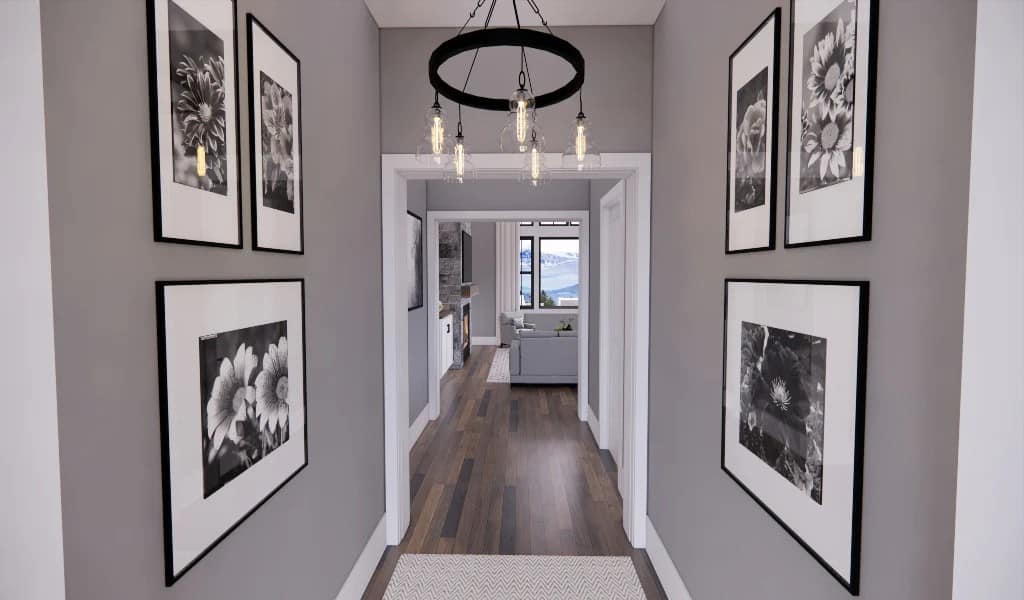 Floral artworks and a wrought iron chandelier adorn the foyer.