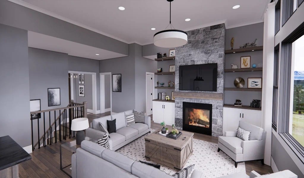 The great room has a stone fireplace, wooden built-ins, and a rustic coffee table surrounded by gray seats.