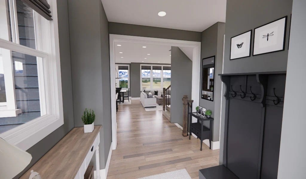 The foyer has a coat rack and a view of the open living space beyond.