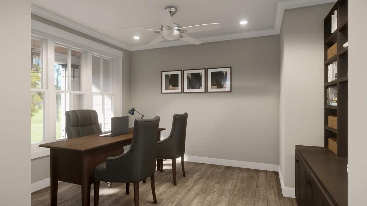 The home office has a dark wood cabinet and a matching desk complemented with leather chairs.