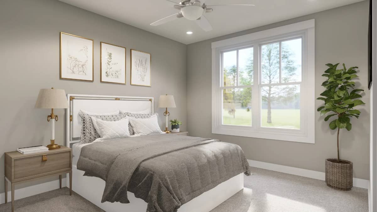 Third bedroom with wooden nightstands and a white bed adorned with framed artworks.