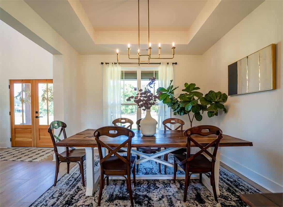 A decorative tray ceiling crowns the formal dining room.