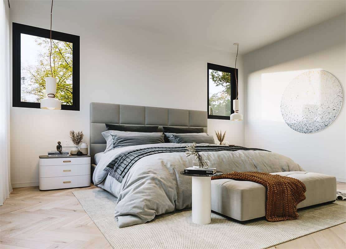 The primary bedroom features a leather upholstered bed complemented with modern nightstands and a tufted bench.