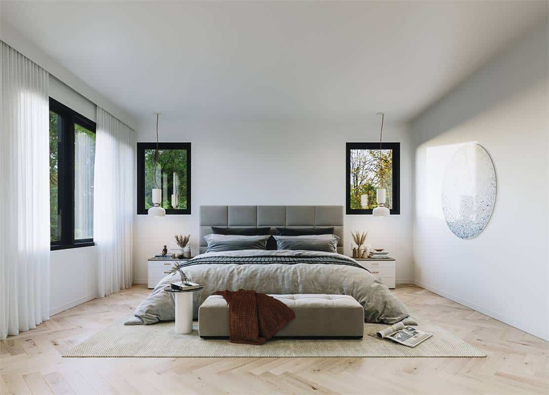 Aluminum framed windows fill the primary bedroom with natural light.