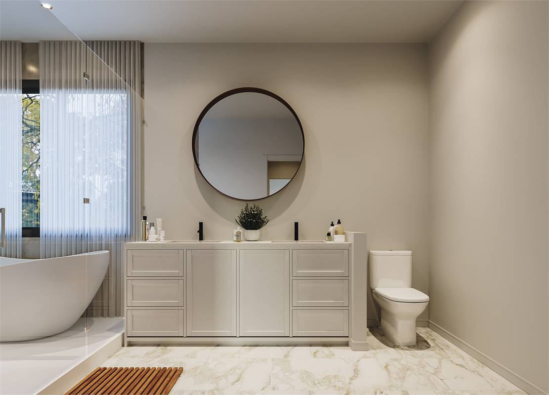 A toilet next to the vanity completes the primary bathroom.