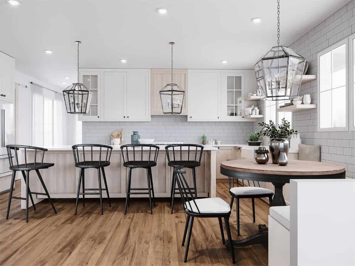 The breakfast nook with a round dining set adjoins the kitchen.