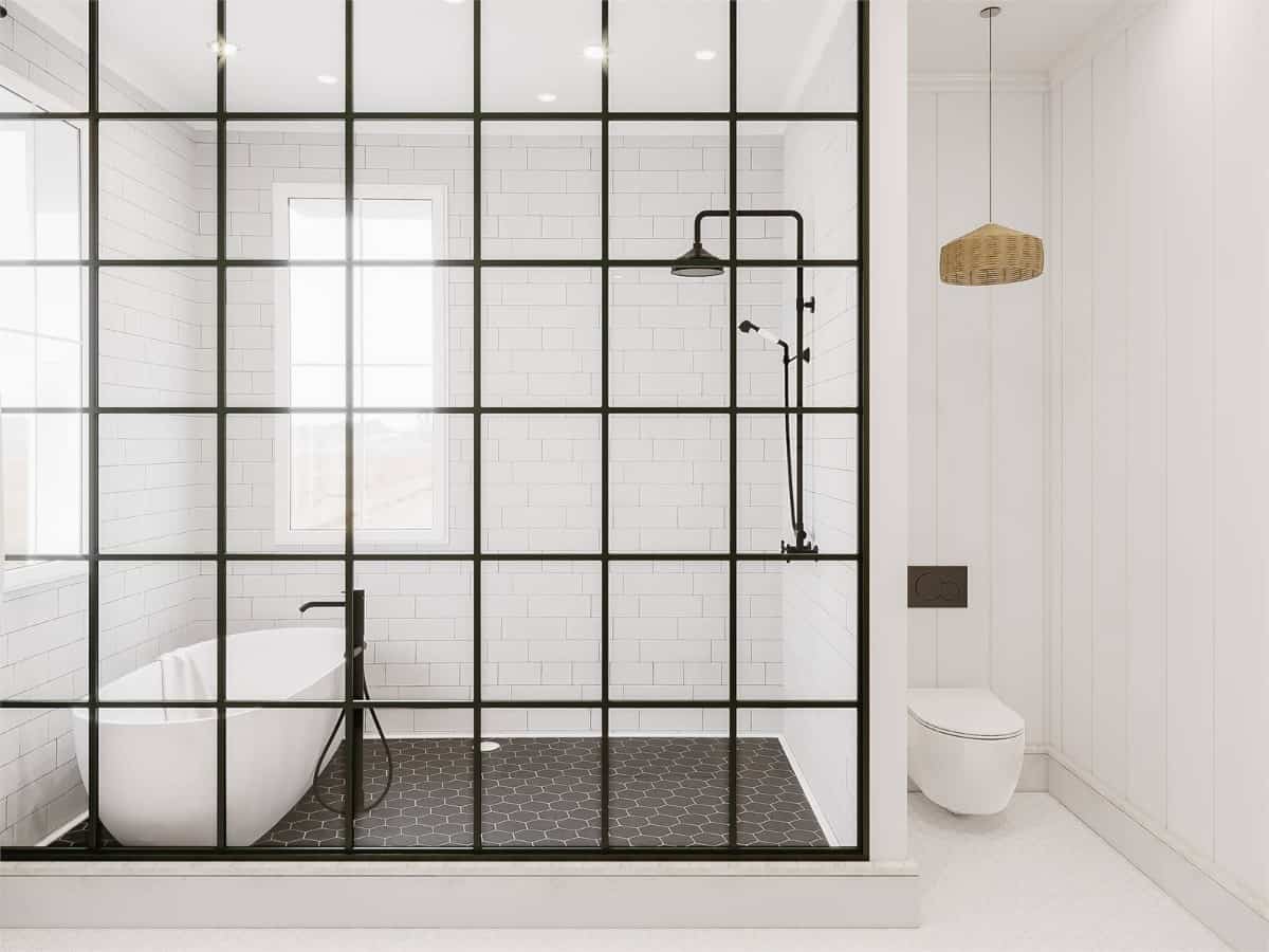 The wet room includes a freestanding tub illuminated by white-framed windows.