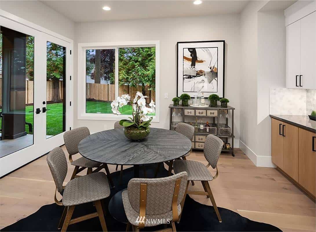 Breakfast nook with outdoor access and a round dining set for six.