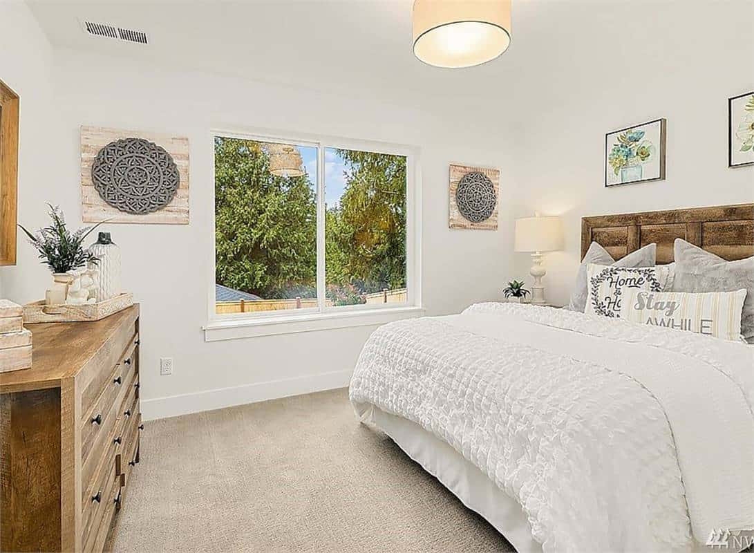Fourth bedroom with a rustic wooden bed that matches the opposite dresser.