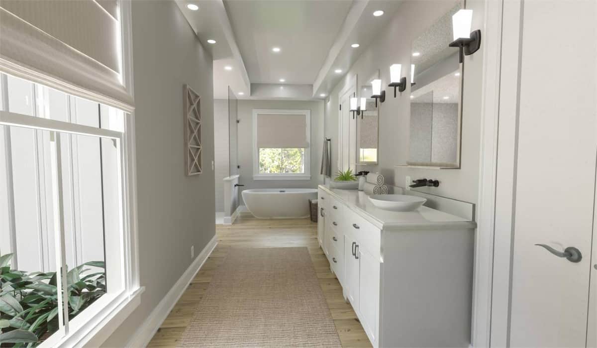 Picture windows fill the primary bathroom with natural light.