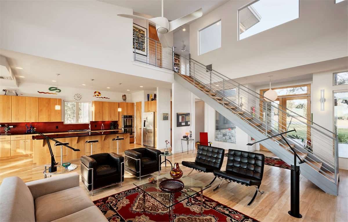 Glazed doors and transom windows fill the soaring great room with ample natural light.