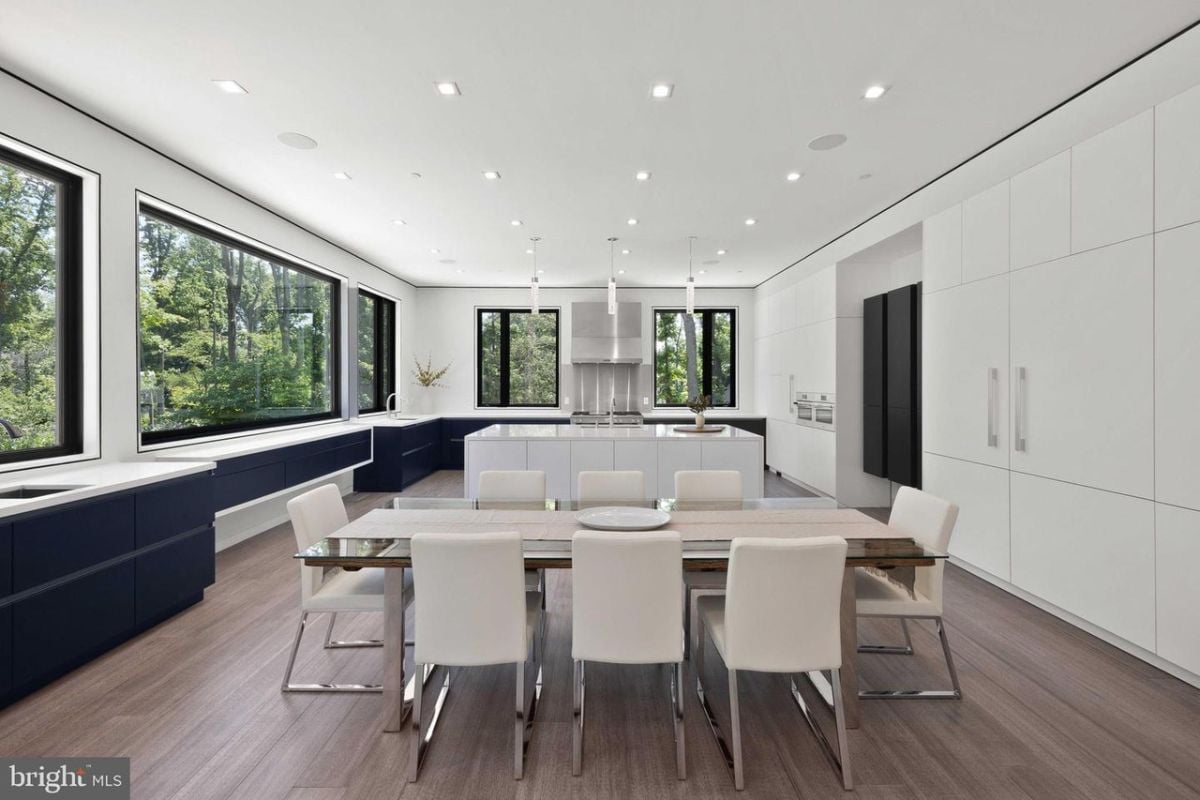 A dining table and kitchen.