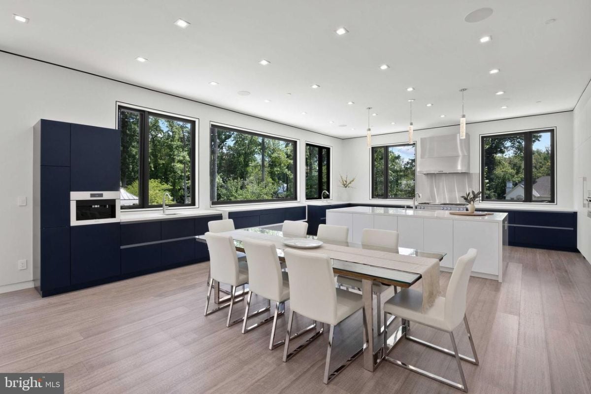 Spacious dining table and kitchen.