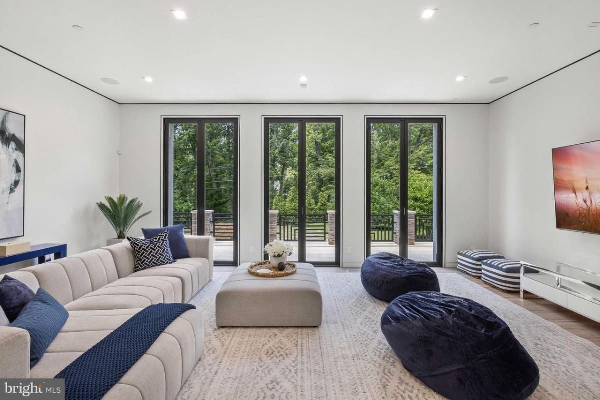 A living room with a large couch and a television.