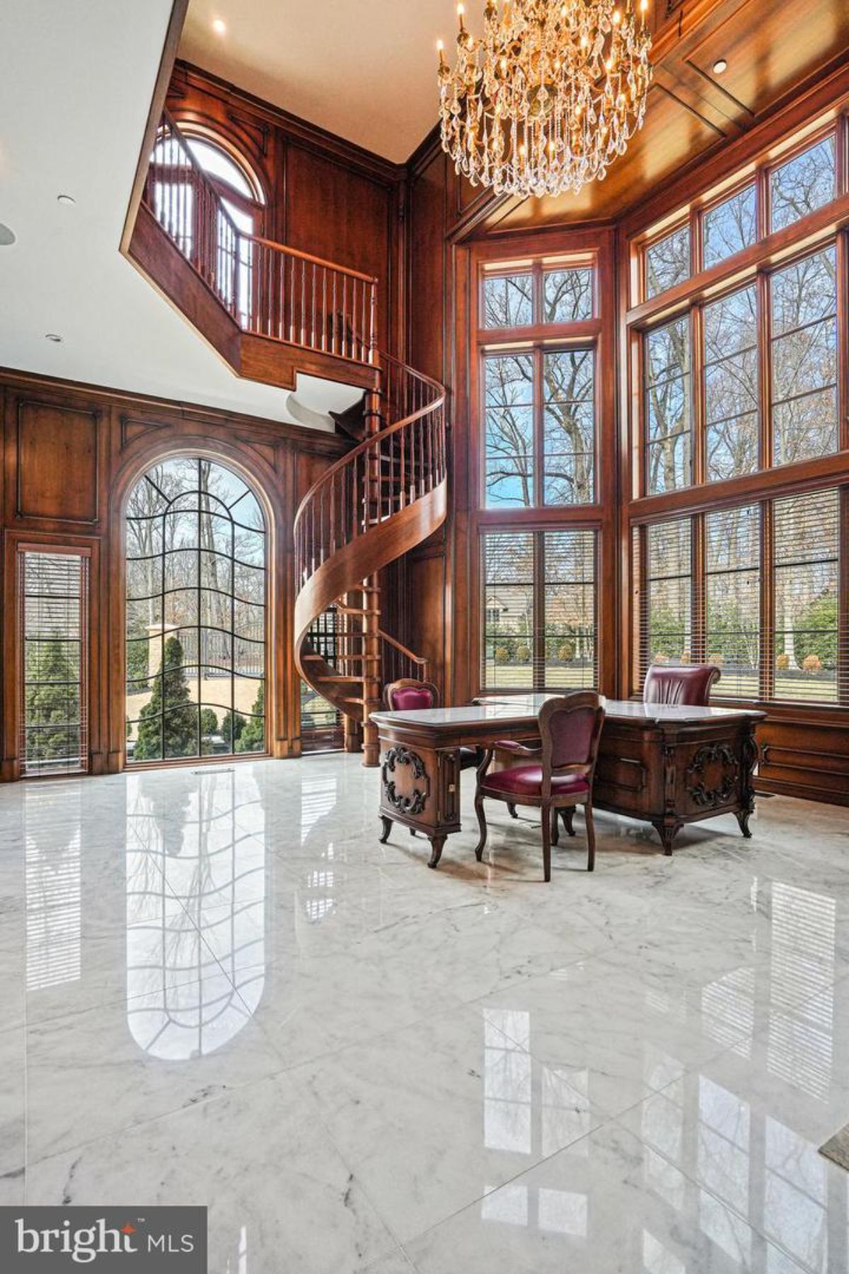 Home office with a spiral staircase.