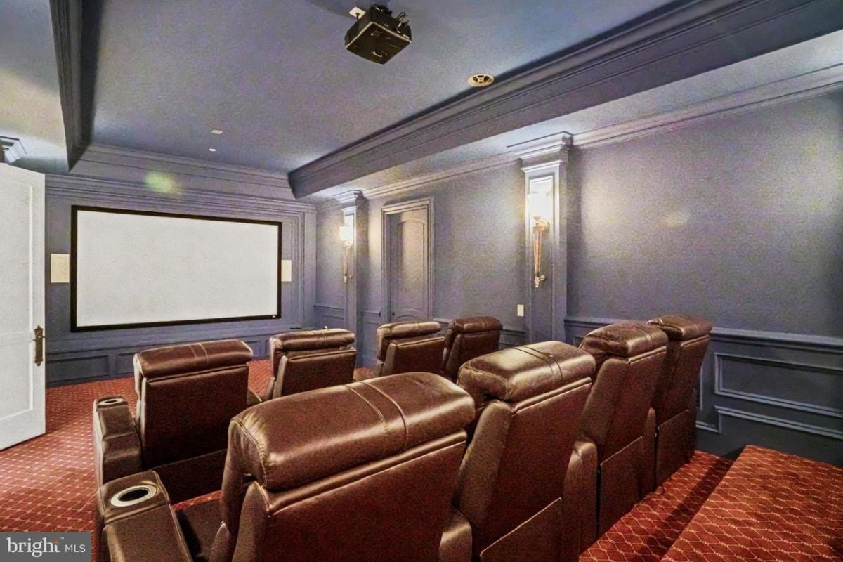 Home theater with leather chairs.