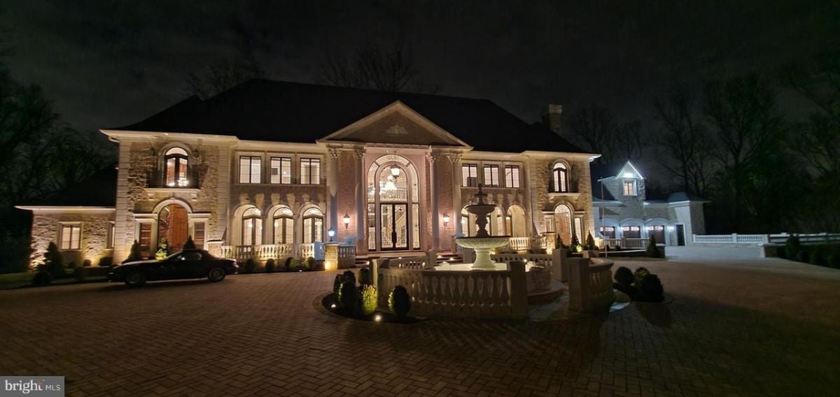 A large house with a driveway.