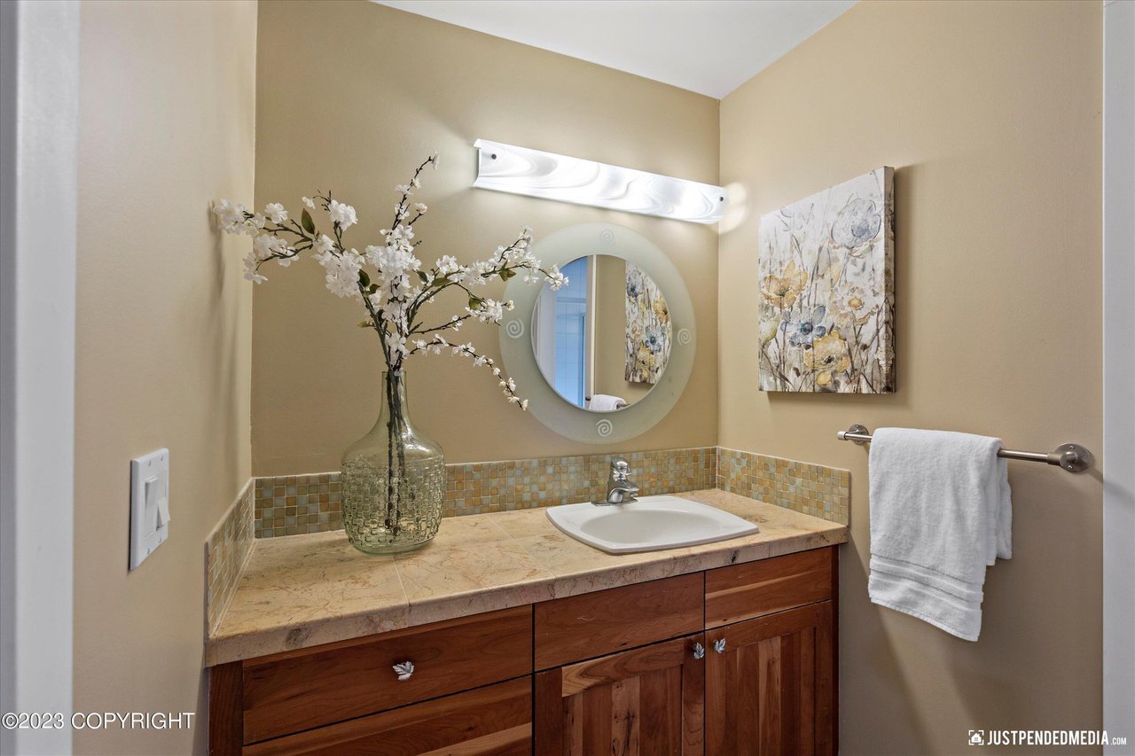 Bathroom with a sink and mirror.
