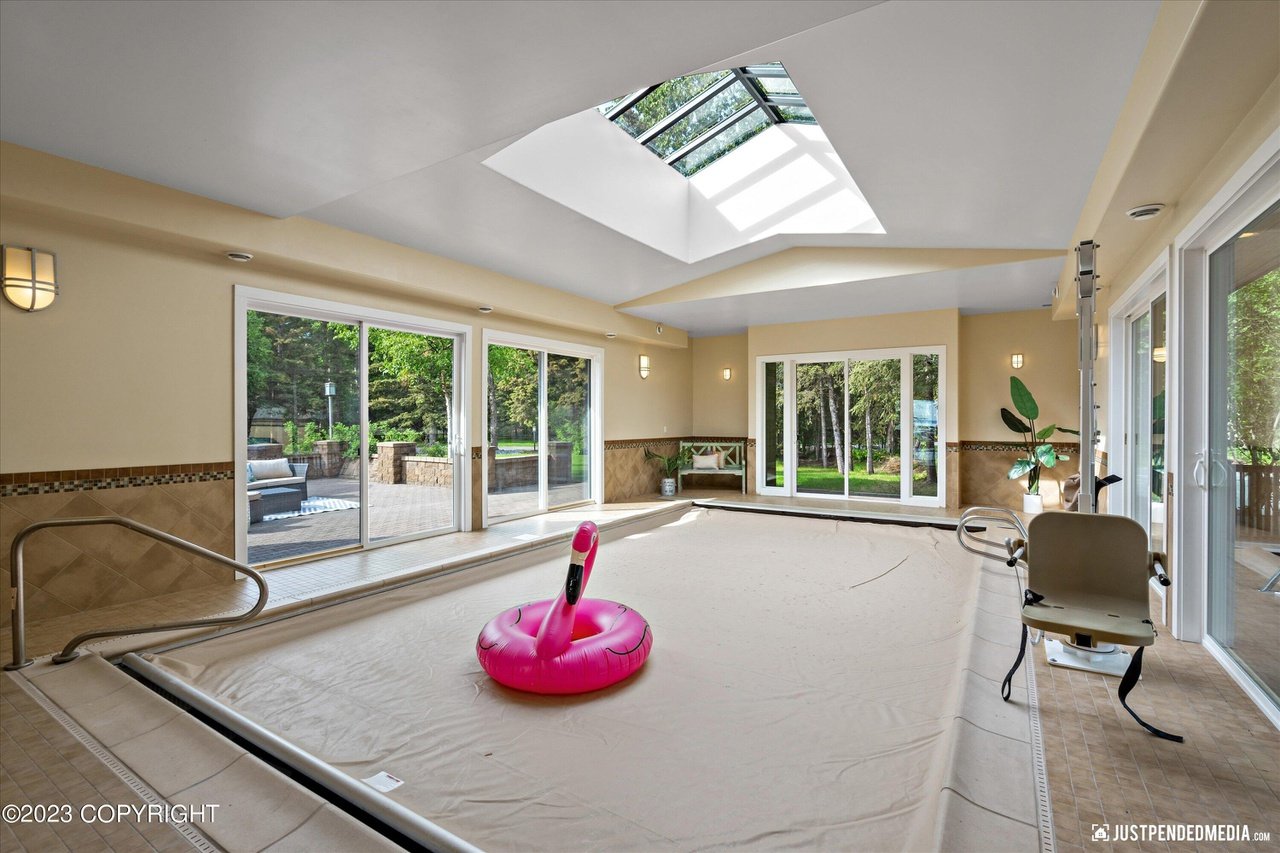Spacious indoor pool with a skylight.