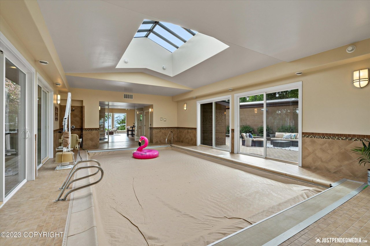 Large indoor pool with a skylight.