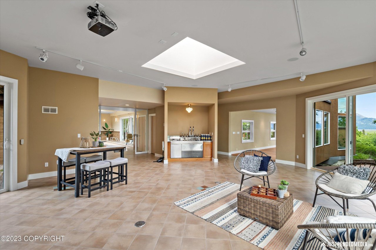 A living room with a large open floor plan.