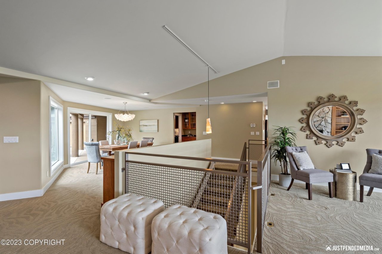 A living room with a staircase.