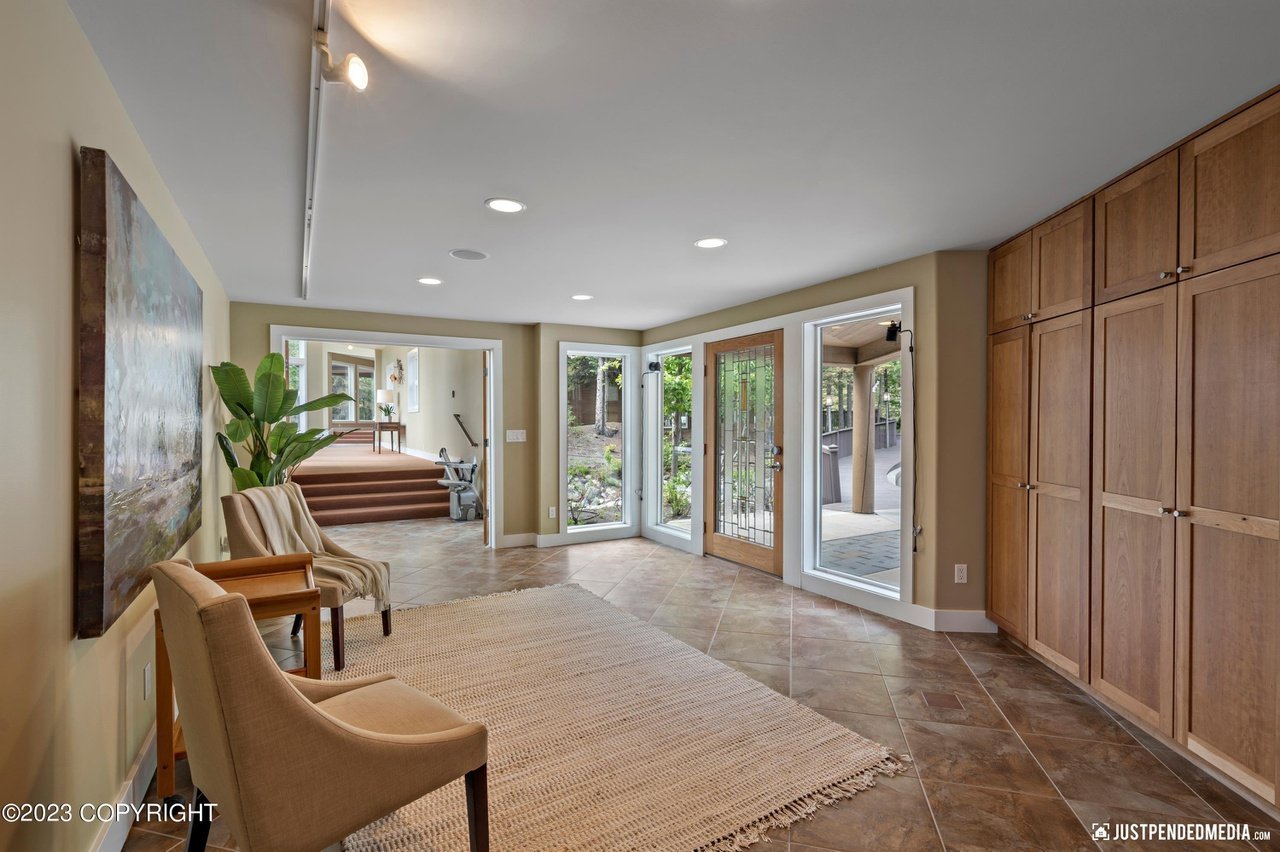 Foyer with chairs and table.