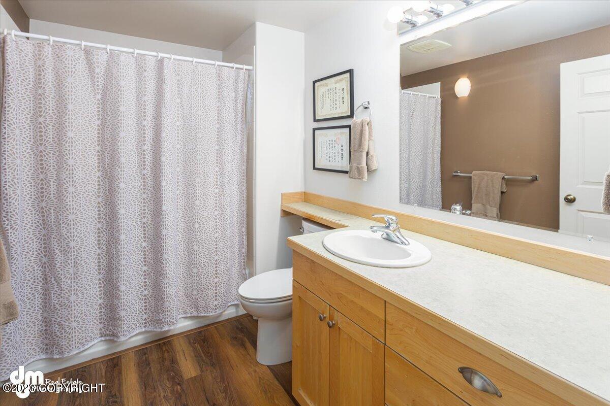 Bathroom with a shower, sink and mirror.