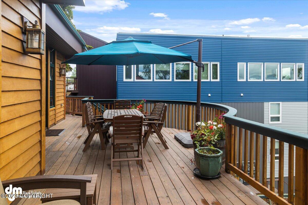 A deck with a table and chairs.