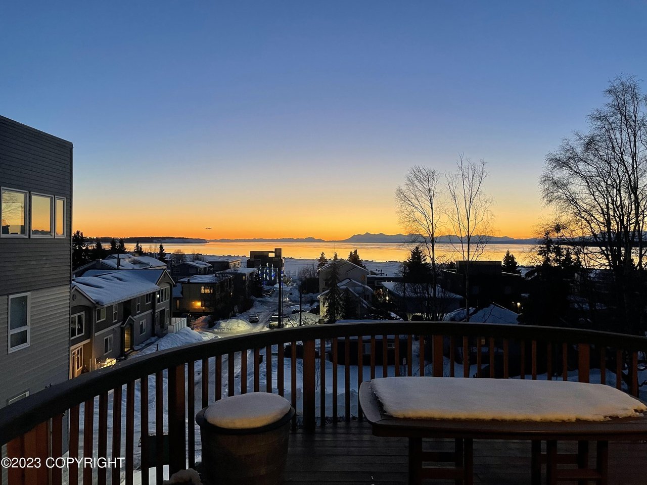 A view of the sunset from a deck.