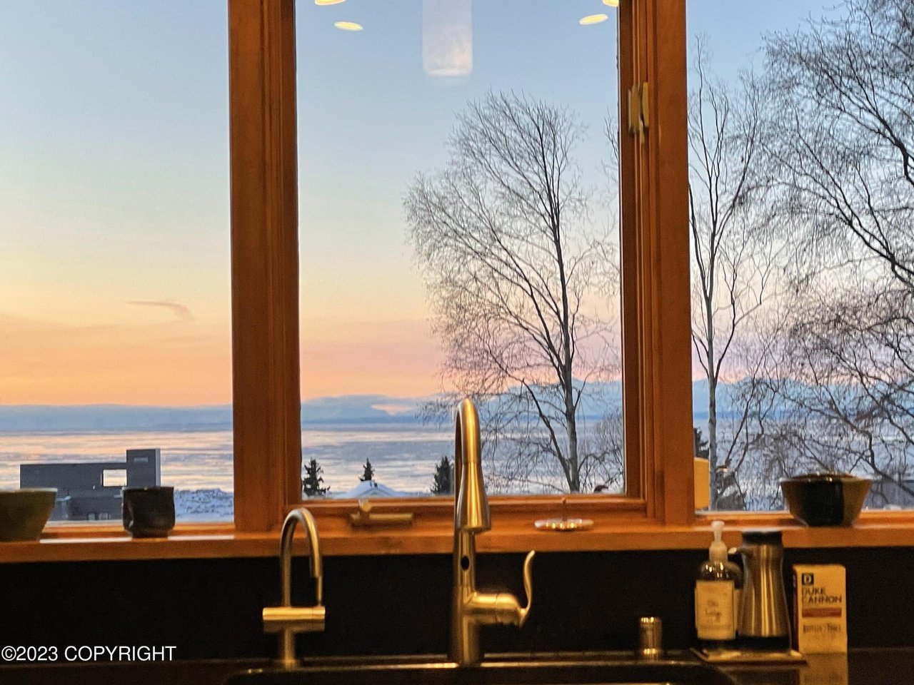 A view of the ocean through a window.