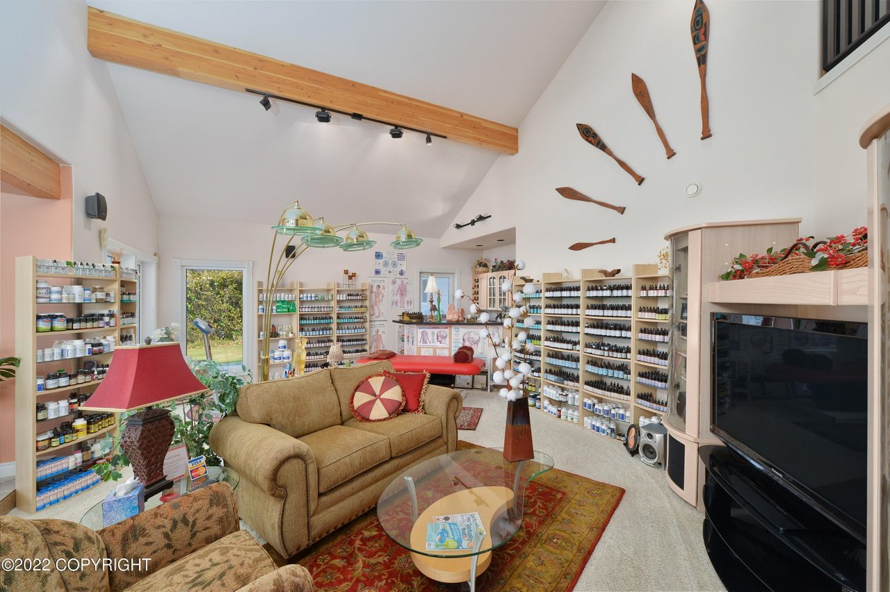 A living room with a couch and television.