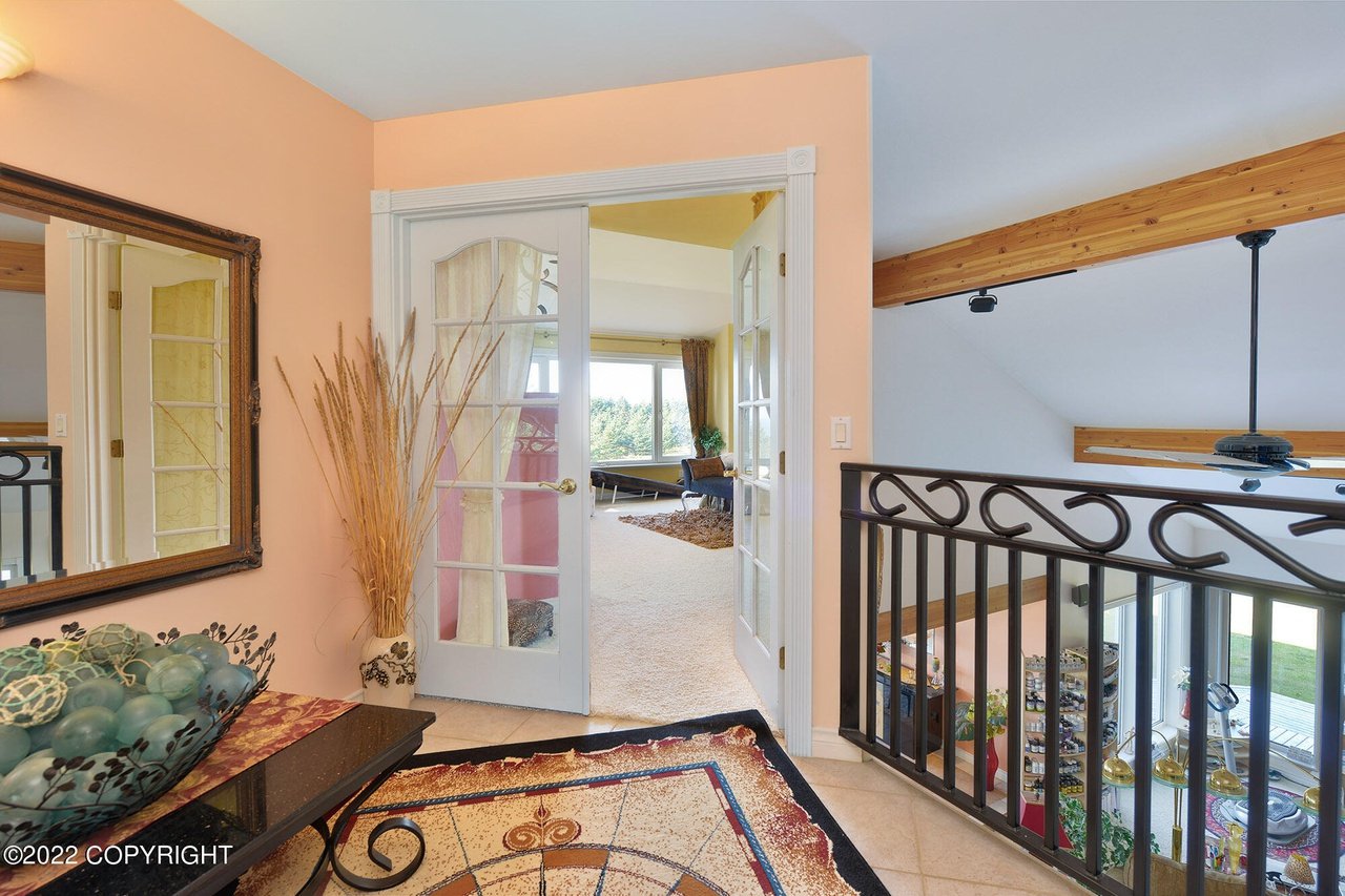 View of a room from a balcony.