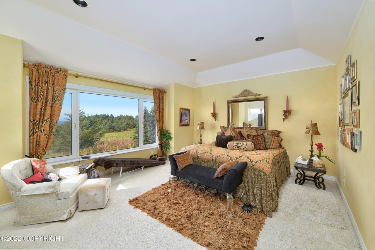 A bedroom with a couch.